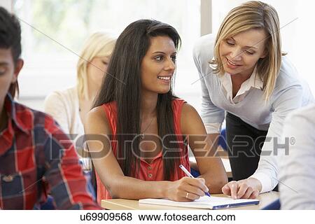 Stock Photo - Students and tutor in class. Fotosearch