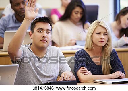 Stock Photograph - Students Using Laptops And Digital Tablets In Lecture. Fotosearch