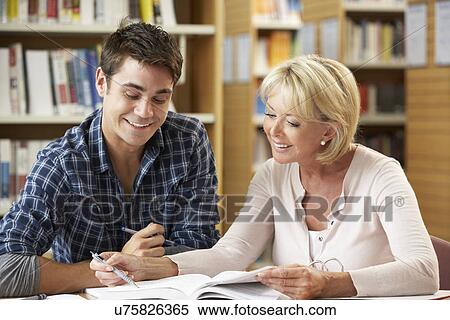 Students working in library View Large Photo Image Stock Photography - Students working in library. Fotosearch