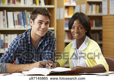 Students working in library View Large Photo Image Stock Photography - Students working in library. Fotosearch