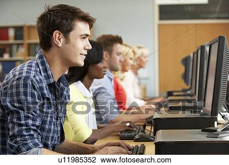 Students working on computers in library View Large Photo Image Stock Image - Students working on computers in library. Fotosearch