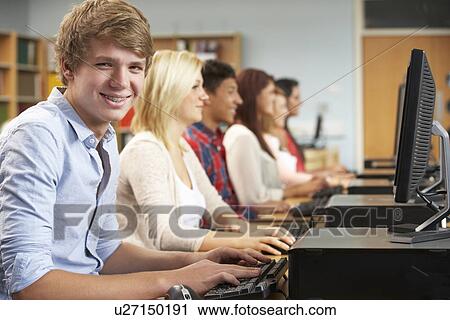 Students working on computers in library View Large Photo Image Stock Image - Students working on computers in library. Fotosearch