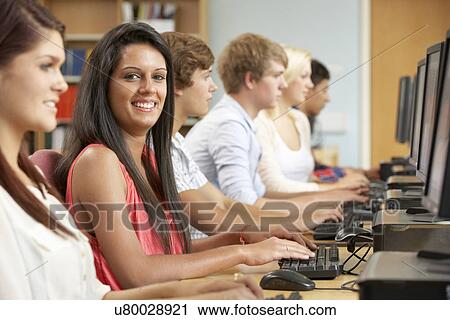 Students working on computers in library View Large Photo Image Stock Image - Students working on computers in library. Fotosearch