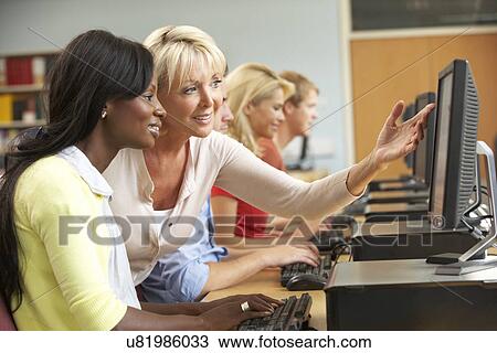 Students working on computers in library View Large Photo Image Stock Image - Students working on computers in library. Fotosearch