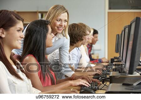 Students working on computers in library View Large Photo Image Stock Image - Students working on computers in library. Fotosearch