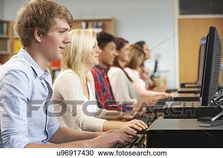 Students working on computers in library View Large Photo Image Stock Image - Students working on computers in library. Fotosearch