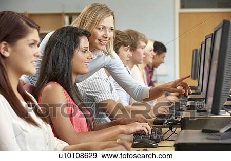 Students working on computers in library View Large Photo Image Stock Photo - Students working on computers in library. Fotosearch