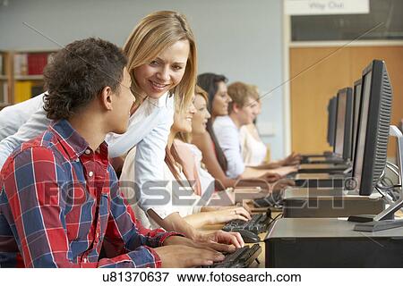 Students working on computers in library View Large Photo Image Stock Photo - Students working on computers in library. Fotosearch