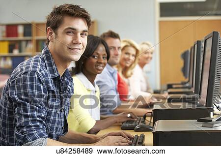Stock Photo - Students working on computers in library. Fotosearch