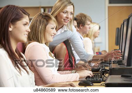 Stock Photo - Students working on computers in library. Fotosearch