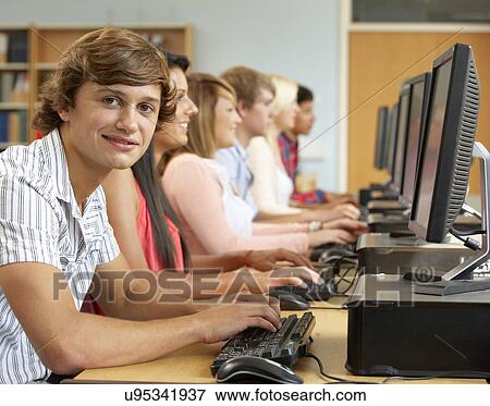 Students working on computers in library View Large Photo Image Stock Photo - Students working on computers in library. Fotosearch