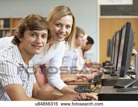 Stock Photograph - Students working on computers in library. Fotosearch