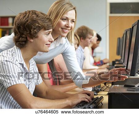Stock Photography - Students working on computers in library. Fotosearch