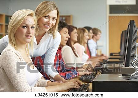 Stock Photography - Students working on computers in library. Fotosearch