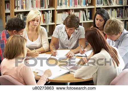 Students working together in library View Large Photo Image Stock Image - Students working together in library. Fotosearch