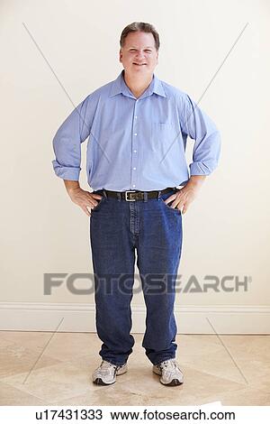 Studio Portrait Of Smiling Overweight Man View Large Photo Image Stock Image - Studio Portrait Of Smiling Overweight Man . Fotosearch