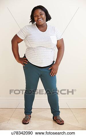 Studio Portrait Of Smiling Overweight Woman View Large Photo Image Stock Image - Studio Portrait Of Smiling Overweight Woman . Fotosearch