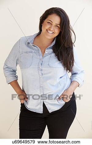 Stock Photo - Studio Portrait Of Smiling Overweight Woman . Fotosearch