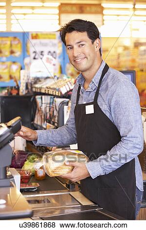 Supermarket checkout worker View Large Photo Image Stock Photo - Supermarket checkout worker. Fotosearch