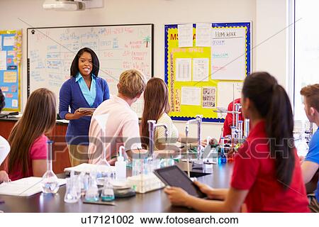 Teacher And Pupils In High School Science Class View Large Photo Image Stock Image - Teacher And Pupils In High School Science Class. Fotosearch