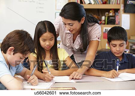 Teacher and schoolchildren in class View Large Photo Image Stock Image - Teacher and schoolchildren in class. Fotosearch