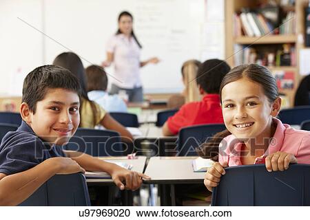 Teacher and schoolchildren in class View Large Photo Image Stock Image - Teacher and schoolchildren in class. Fotosearch