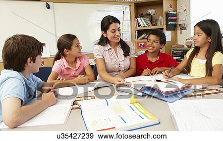 Teacher and schoolchildren in class View Large Photo Image Stock Photo - Teacher and schoolchildren in class. Fotosearch