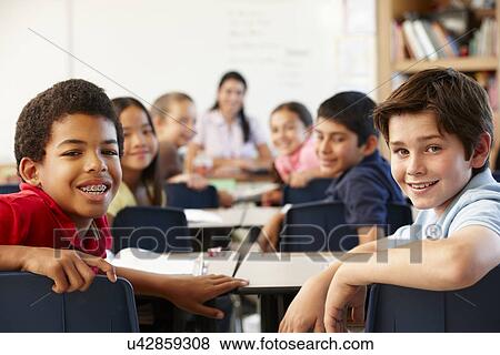 Teacher and schoolchildren in class View Large Photo Image Stock Photo - Teacher and schoolchildren in class. Fotosearch