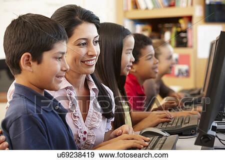 Teacher and schoolchildren in class View Large Photo Image Stock Photo - Teacher and schoolchildren in class. Fotosearch