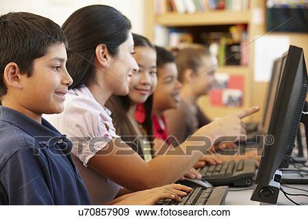 Teacher and schoolchildren in class View Large Photo Image Stock Photo - Teacher and schoolchildren in class. Fotosearch