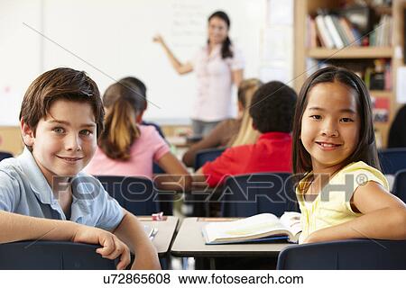 Teacher and schoolchildren in class View Large Photo Image Stock Photo - Teacher and schoolchildren in class. Fotosearch