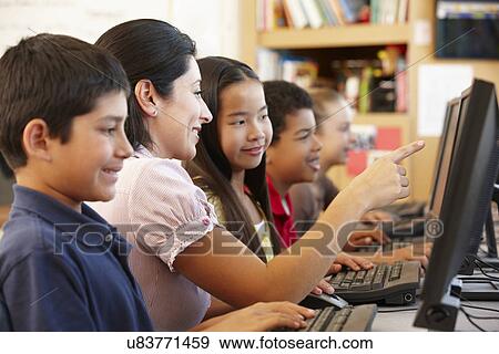 Teacher and schoolchildren in class View Large Photo Image Stock Photo - Teacher and schoolchildren in class. Fotosearch