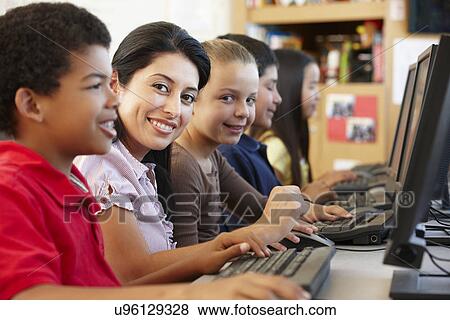 Teacher and schoolchildren in class View Large Photo Image Stock Photo - Teacher and schoolchildren in class. Fotosearch