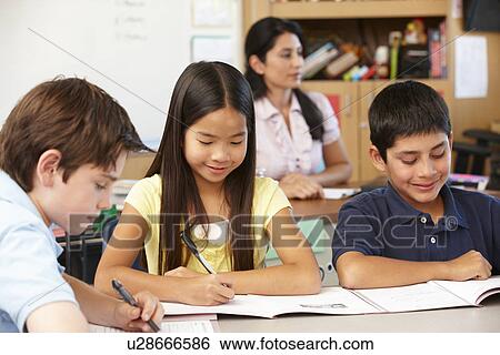 Stock Photograph - Teacher and schoolchildren in class. Fotosearch