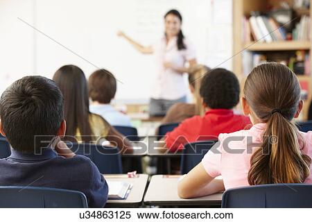 Stock Photography - Teacher and schoolchildren in class. Fotosearch
