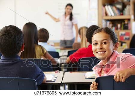 Stock Photography - Teacher and schoolchildren in class. Fotosearch