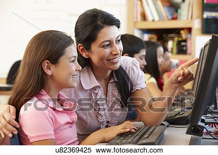 Stock Photography - Teacher and schoolchildren in class. Fotosearch