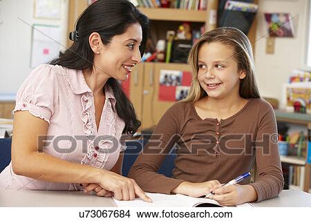 Teacher and schoolgirl in class View Large Photo Image Picture - Teacher and schoolgirl in class. Fotosearch