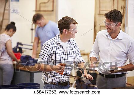 Teacher Helping College Students Studying Plumbing View Large Photo Image Stock Image - Teacher Helping College Students Studying Plumbing. Fotosearch