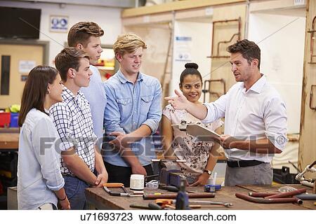 Teacher Helping College Students Studying Plumbing View Large Photo Image Stock Image - Teacher Helping College Students Studying Plumbing. Fotosearch