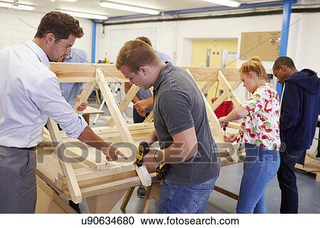 Teacher Helping College Students Studying Carpentry View Large Photo Image Stock Image - Teacher Helping College Students Studying Carpentry. Fotosearch