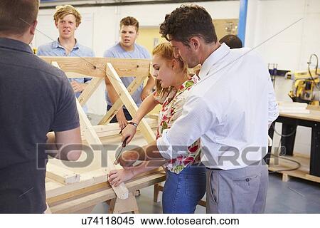 Teacher Helping College Students Studying Carpentry View Large Photo Image Stock Photography - Teacher Helping College Students Studying Carpentry. Fotosearch