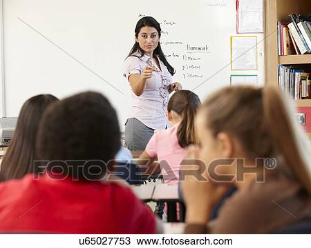 Teacher telling off children in class View Large Photo Image Stock Image - Teacher telling off children in class. Fotosearch