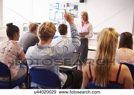 Teacher With College Students Giving Lesson In Classroom View Large Photo Image Stock Photo - Teacher With College Students Giving Lesson In Classroom. Fotosearch