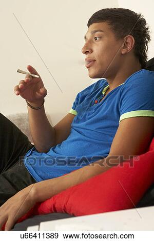 Stock Photo - Teenage boy smoking. Fotosearch