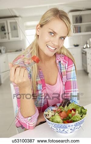 Teenage girl eating salad View Large Photo Image Stock Photo - Teenage girl eating salad. Fotosearch