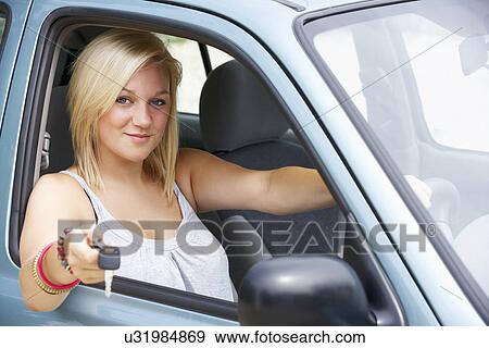 Stock Photo - Teenage girl in car. Fotosearch