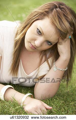Stock Image - Teenage girl outdoors. Fotosearch