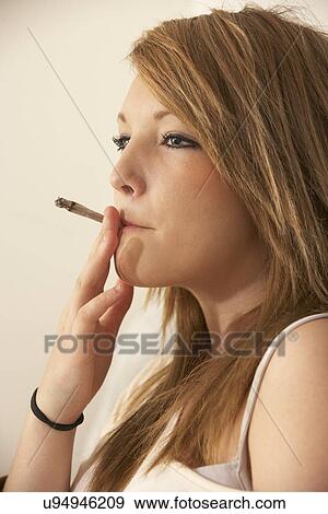 Teenage girl smoking View Large Photo Image Stock Photo - Teenage girl smoking. Fotosearch