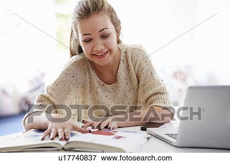 Teenage Girl Studying On Laptop At Home View Large Photo Image Stock Photo - Teenage Girl Studying On Laptop At Home. Fotosearch